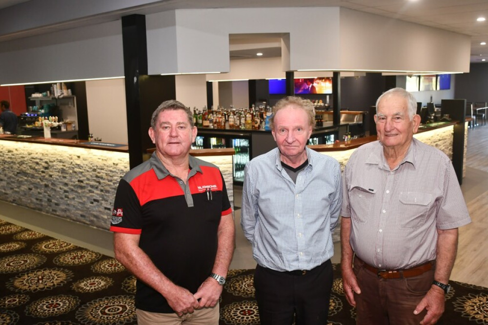 Club president John Wilkinson (left), with manager Bill Coffey and treasurer Frank Gallo in front of the new main bar.