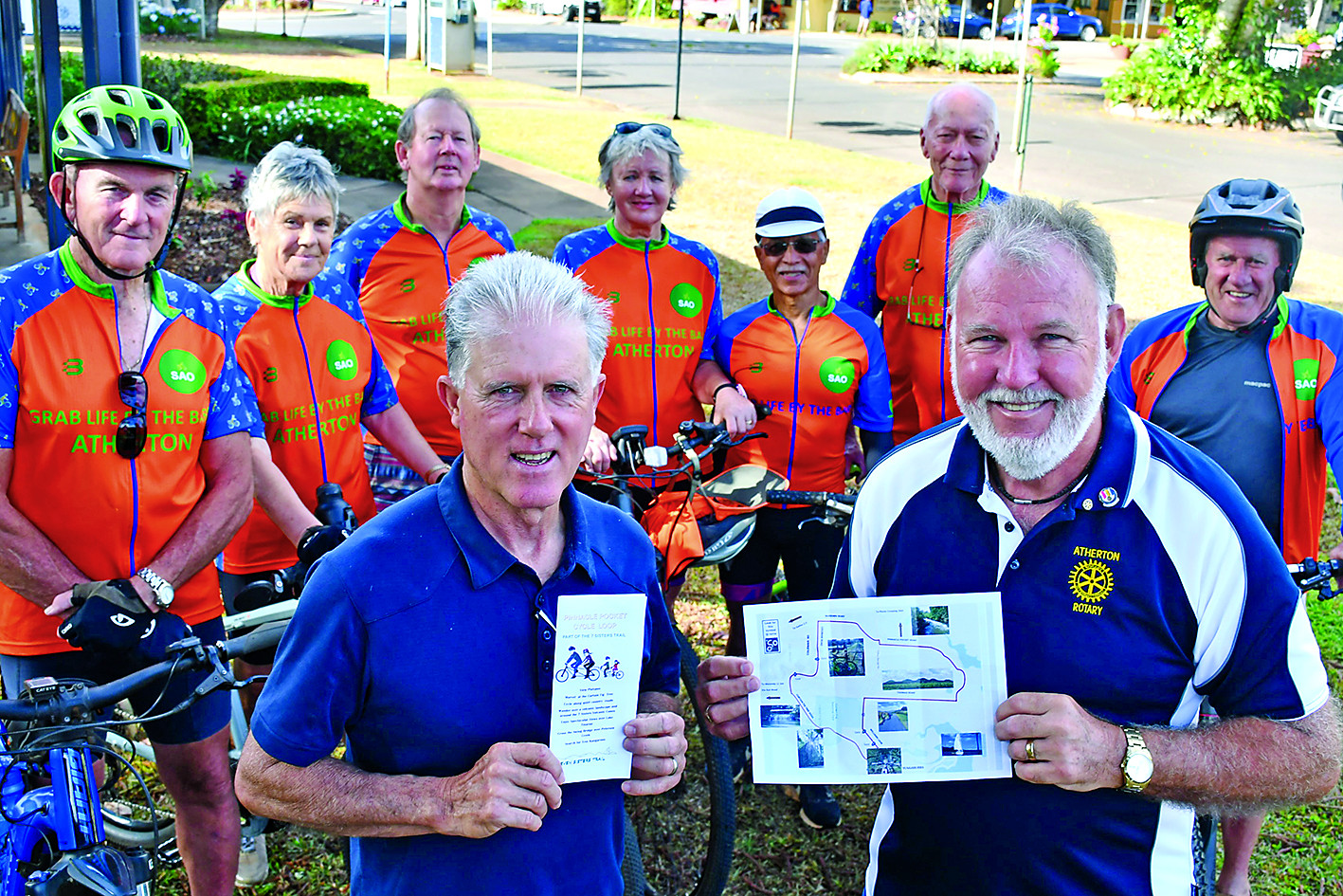 Tablelands Regional Council Mayor Rod Marti and Atherton Rotary Club President Mike Brzozowski with Sixty and Overs (SAOs) bike club members with the new brochure funded by Atherton Rotary.