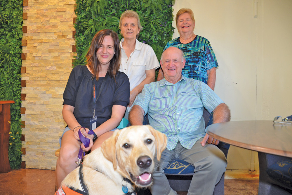 ASDOG’s head trainer Carly Starr, volunteer Claire Marson, president Helen Fuller and treasurer Rob Fuller with a pup currently being trained to help someone with a physical disability