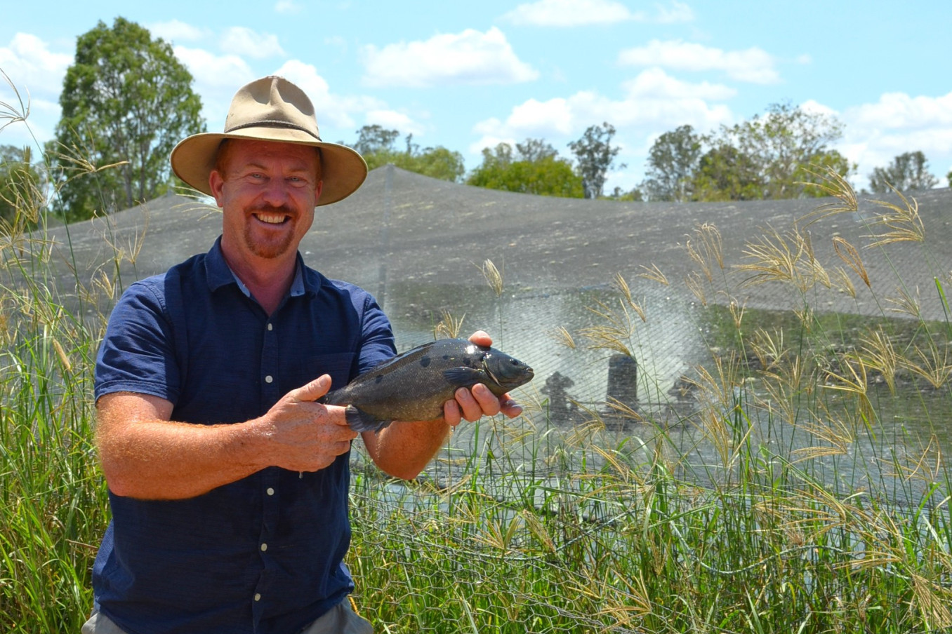 Biboohra barra farmer Rodney Ingersoll OBE (holding a sooty grunter) travelled to Canberra recently, to share his views on how farmers could help Australia reach its 2050 Net Zero targets.
