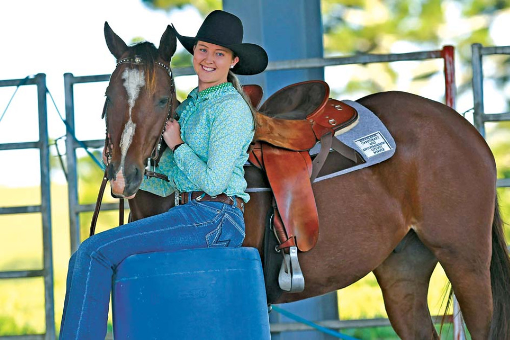 Corissa Evans with her horse “Looking like a Playgirl” ahead of the National Barrel Horse Association World Championships in Georgia USA.