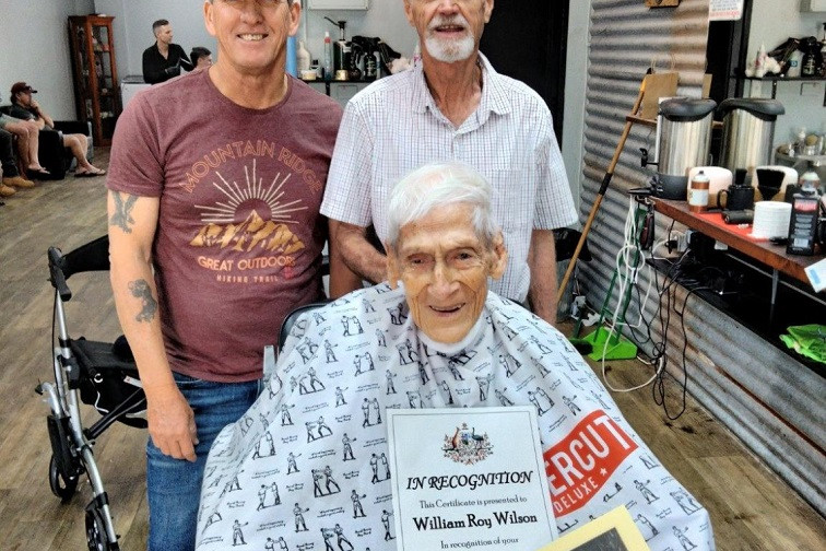 Roy Wilson with his son Ron Wilson and son-in-law Raymond Jerome at Kingpin Barbers in Atherton getting a special 100 birthday haircut.