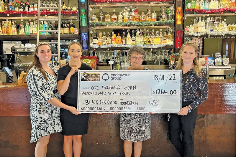 Mareeba Gateway Hotel staff presenting Mareeba Communities Family Health Care board member Betty Dickinson (second from right) with a cheque from the recent Melbourne Cup fundraiser.