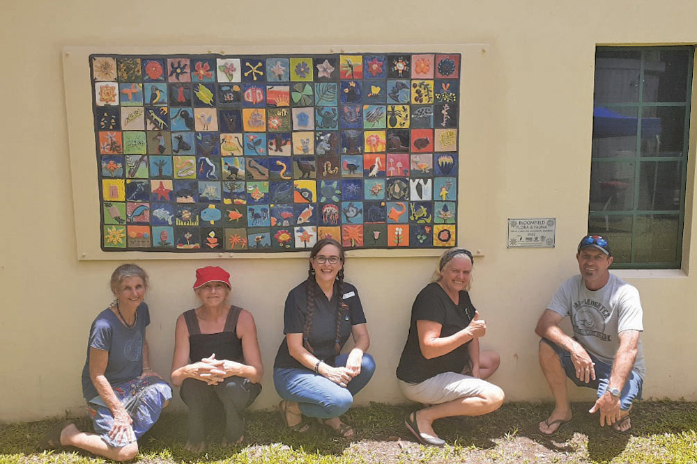 Bloomfield Mural stakeholders Jude Edwards (ceramic artist), Lainie Franzi (project leader and artist/teacher), Marilyn Morris (Cook Shire Councilor), Waratah Nicholls (Regional Arts Service Net-work Far North co-ordinator) and Wayne Hunt (Cooktown Hardware store manager).