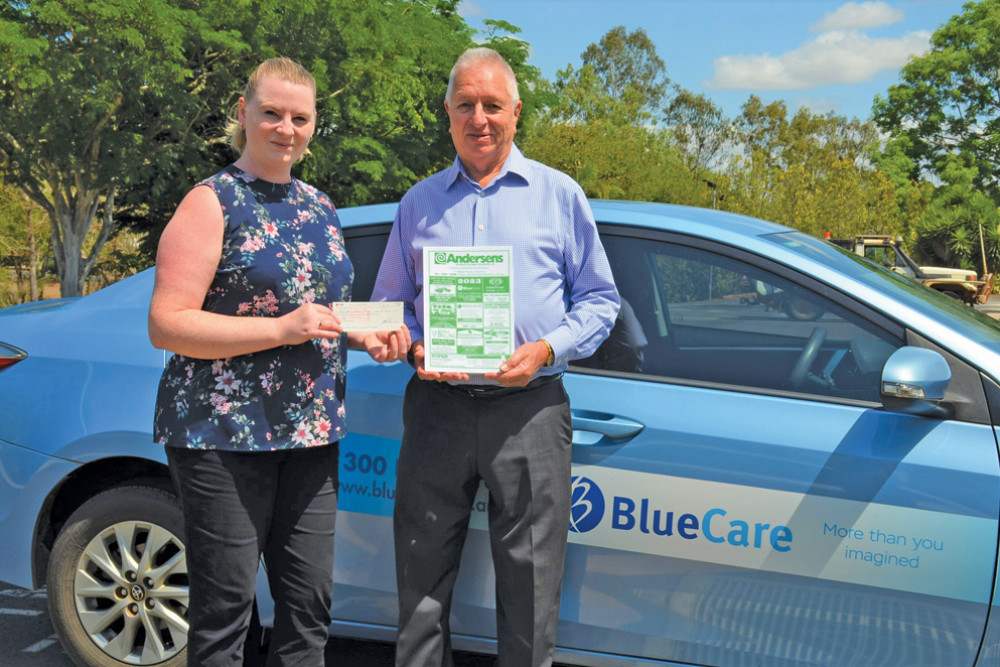 Leigh Robinson presenting BlueCare clinical care coordinator Emily Cowen (left) with a $5,000 cheque