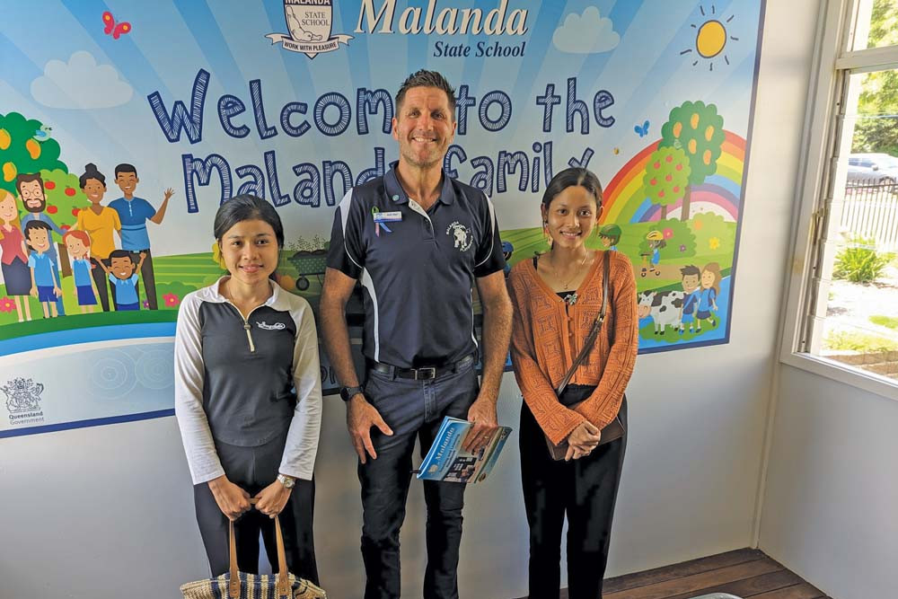 Cambodian exchange students Laihun and Sokvun with Malanda State School principal Mark Allen during their visit. Photo: Sylvia Edwards.