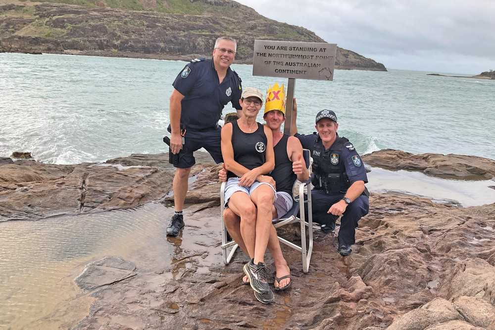 Senior Constable Daniell (left) with Matt, Rebecca and Senior Constable Whitling after their trek to the tip of Cape York.