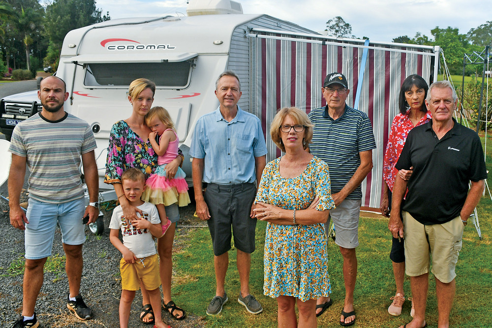 Yungaburra resident Gayle Herring (front) with other temporary tenants of the Lakeside Caravan Park, who are waiting for houses to be built or a rental to become available, are being evicted by the council after staying there for 42 days.