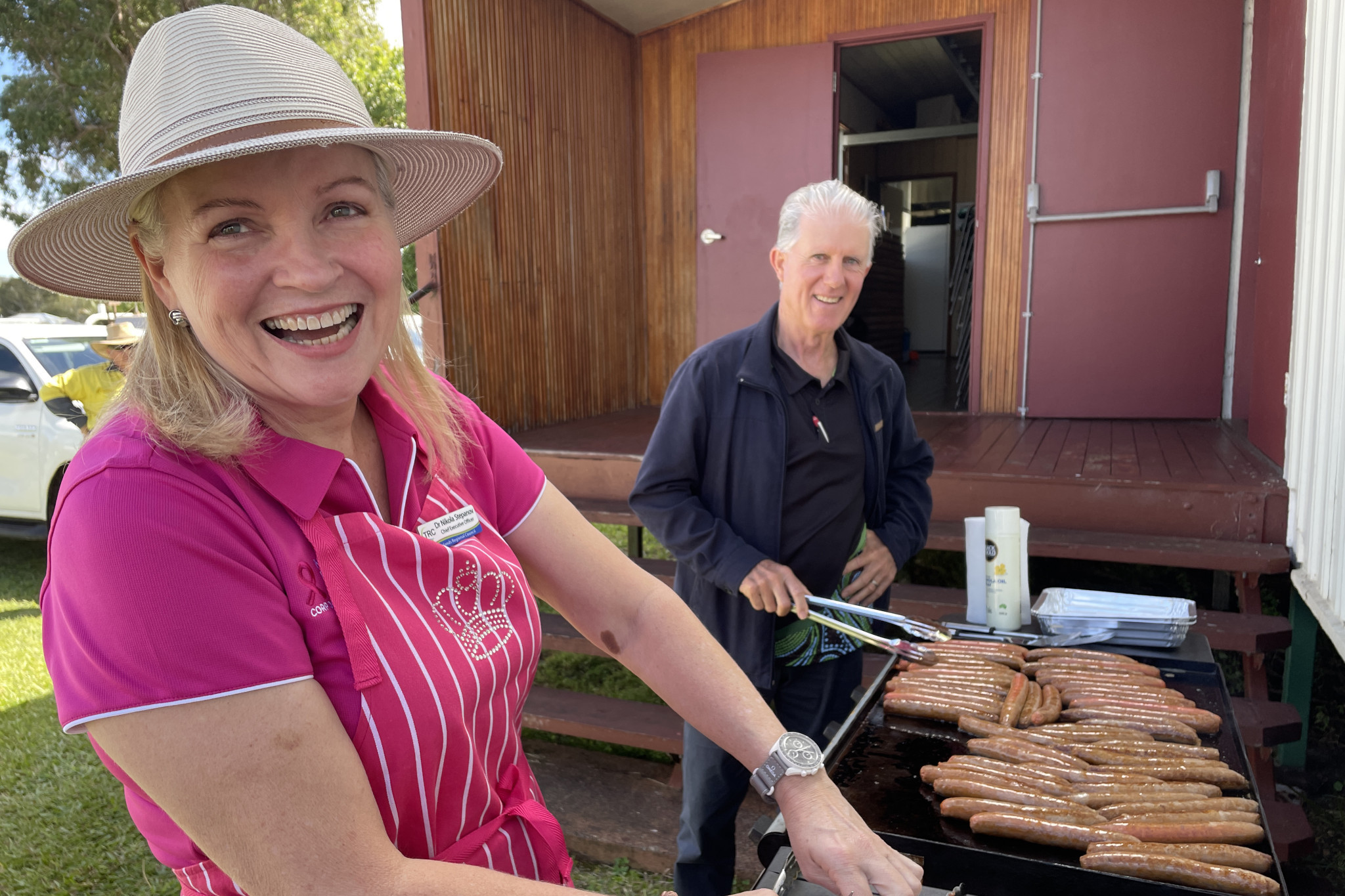 CEO Dr Nikola Stepanov cooks up the barbecue with help from Mayor Rod Marti on her first staff roadshow in Ravenshoe.