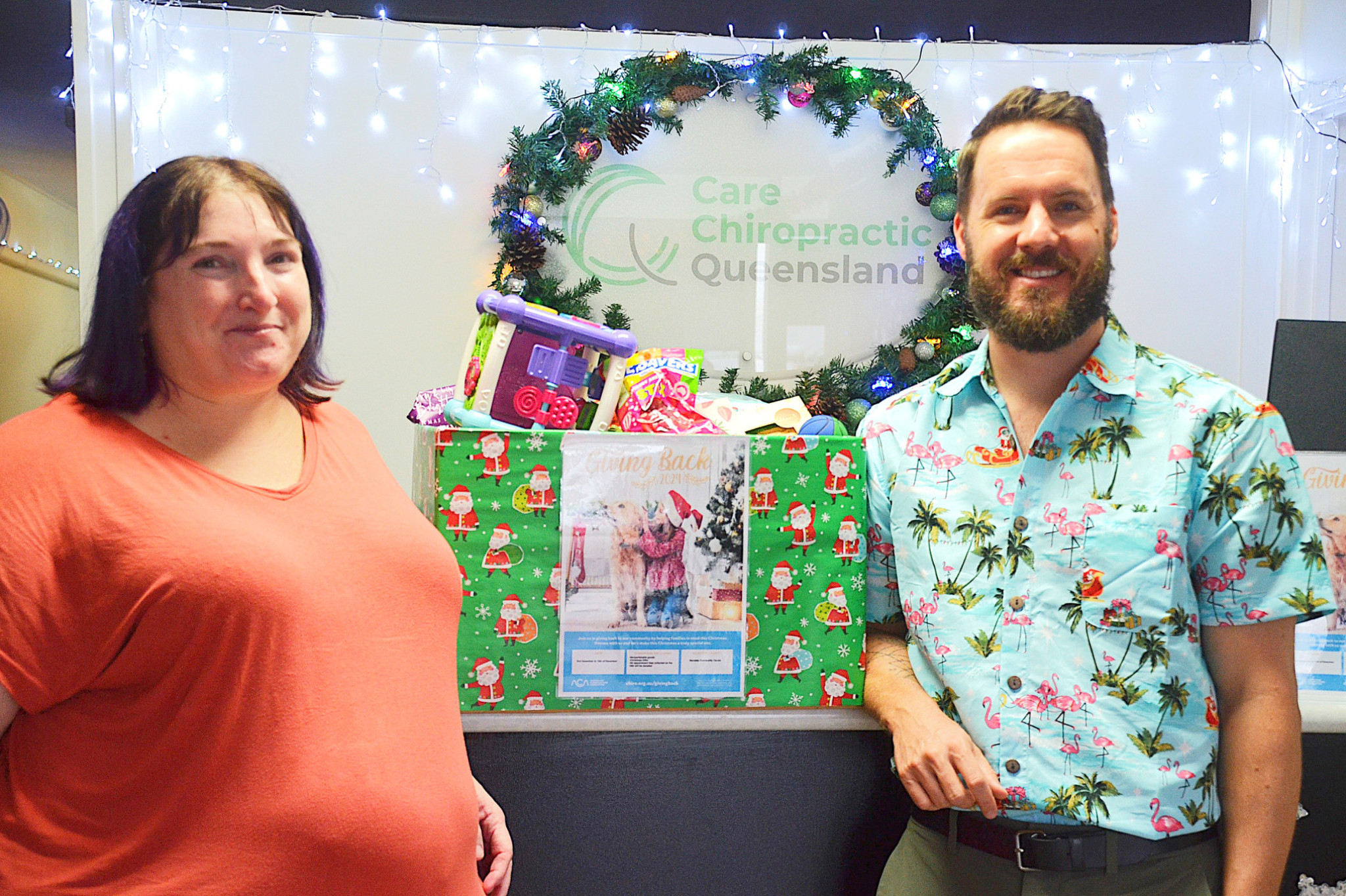 MCC community support worker Sandy Chapman (left) received three big boxes worth of goods and a monetary donation from Care Chiropractic Queensland’s Dr Matt Jacob (right).