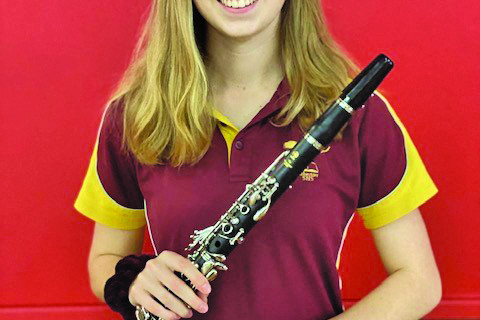 Year 12 student Marni Dennis with one of the three clarinets donated to Atherton High School’s instrumental program.