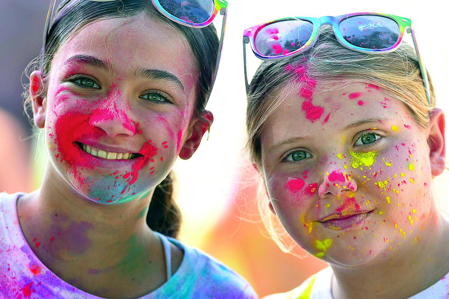 Ava Portelli and Charli Rockley help raise funds at the colour run.