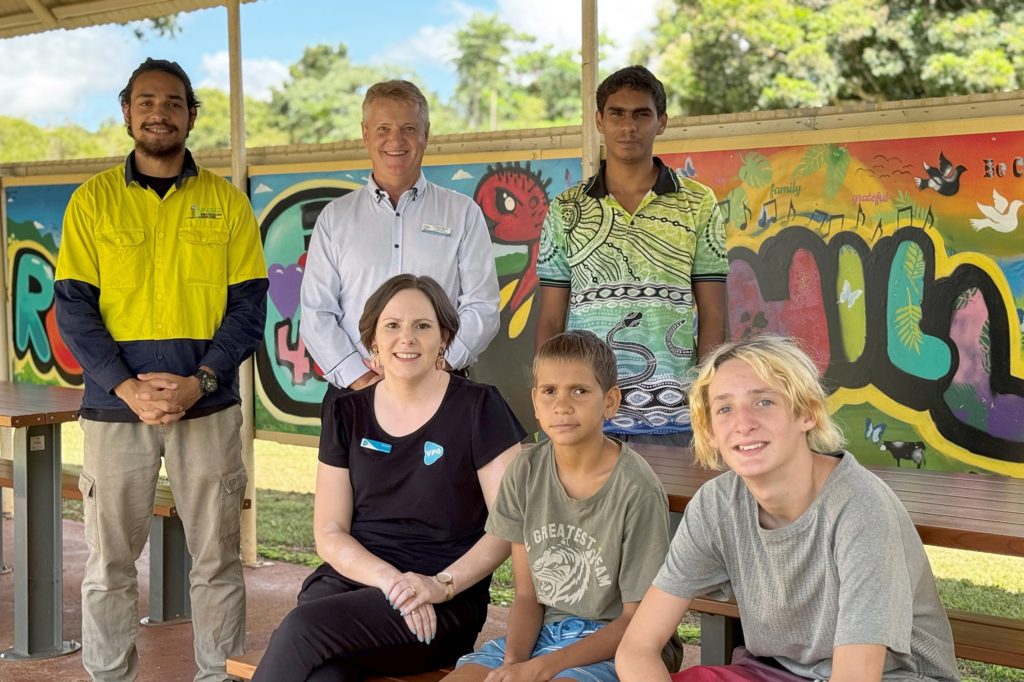 TRC Deputy Mayor Dave Bilney and VPG’s Sarah Marsh with local youth behind Malanda’s new community art.