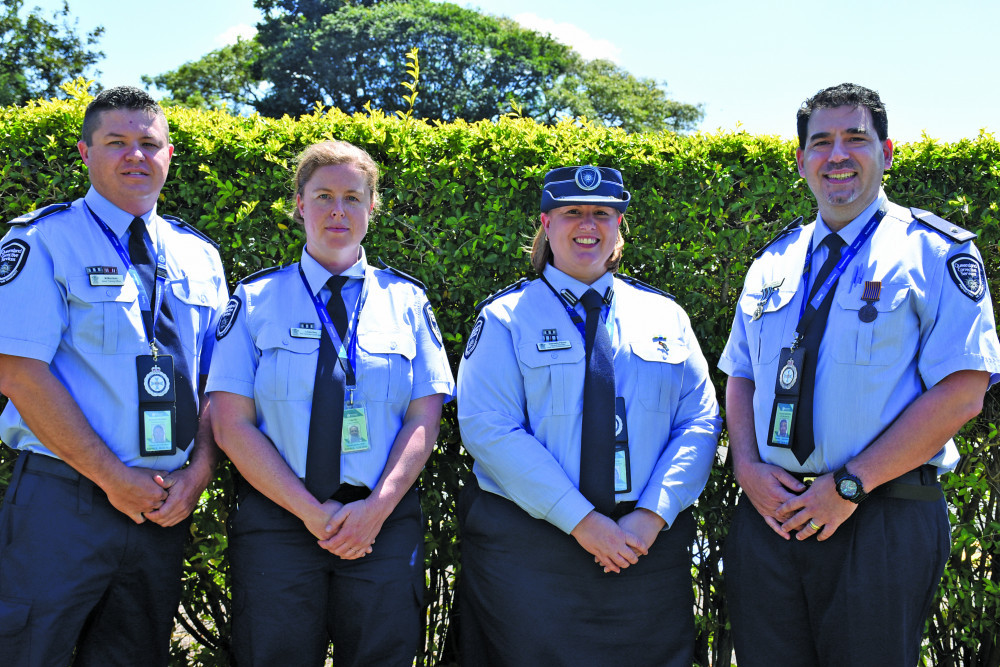 Lotus Glen Correctional Centre trainers Michael Morrison, Linda Roy and Carmelo Salerno with centre Superintendent Gabrielle Payne (third from left) at the recent Correctional Offi cer ceremony in Mareeba.