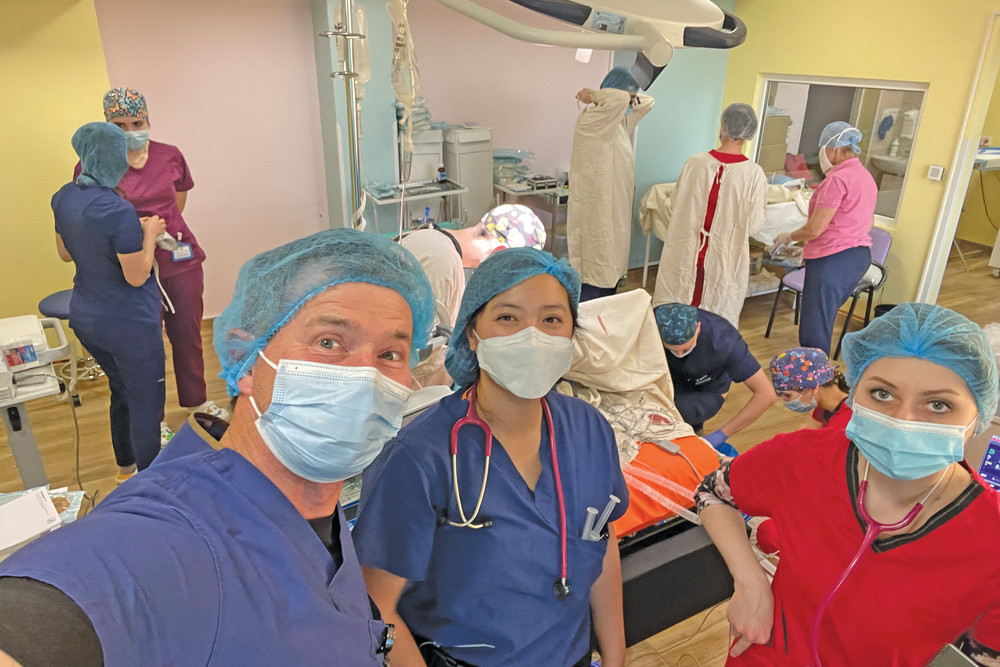 David Keough with Dr Clementine Vo in the operating room in Kviv.