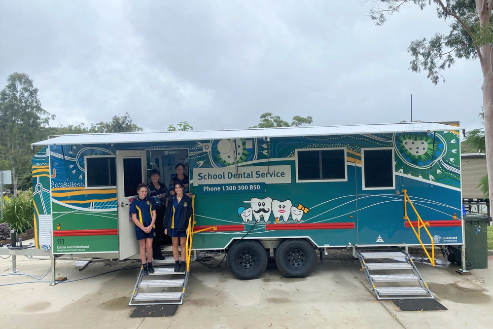 Students Yindali Sharp and Lacey Wyatt with senior dental therapist Sue Lorensen-Bryant and dental assistant Shaneen Brown at one of the new dental vans in Herberton recently.