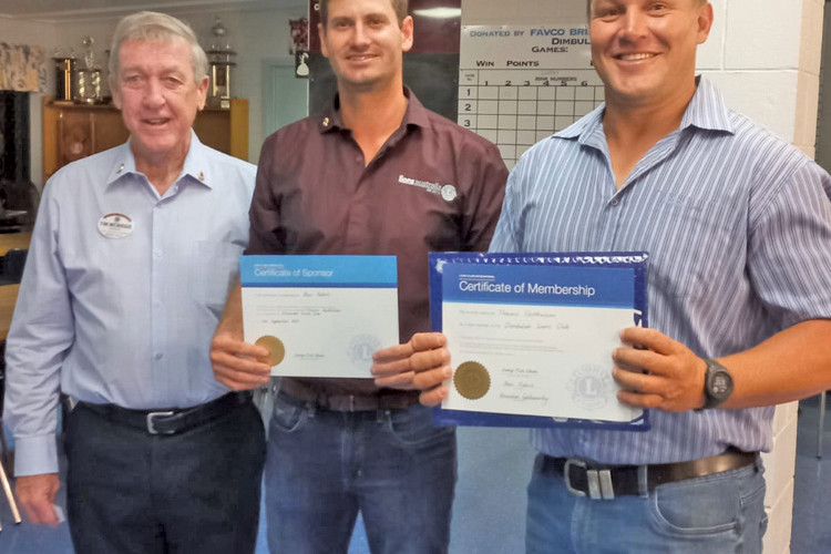 New Dimbulah Lions member Theuns Oosthuizen (right) with sponsor and Dimbulah Lions secretary Ben Fabris (centre) and second vice district governor Tim McBride.