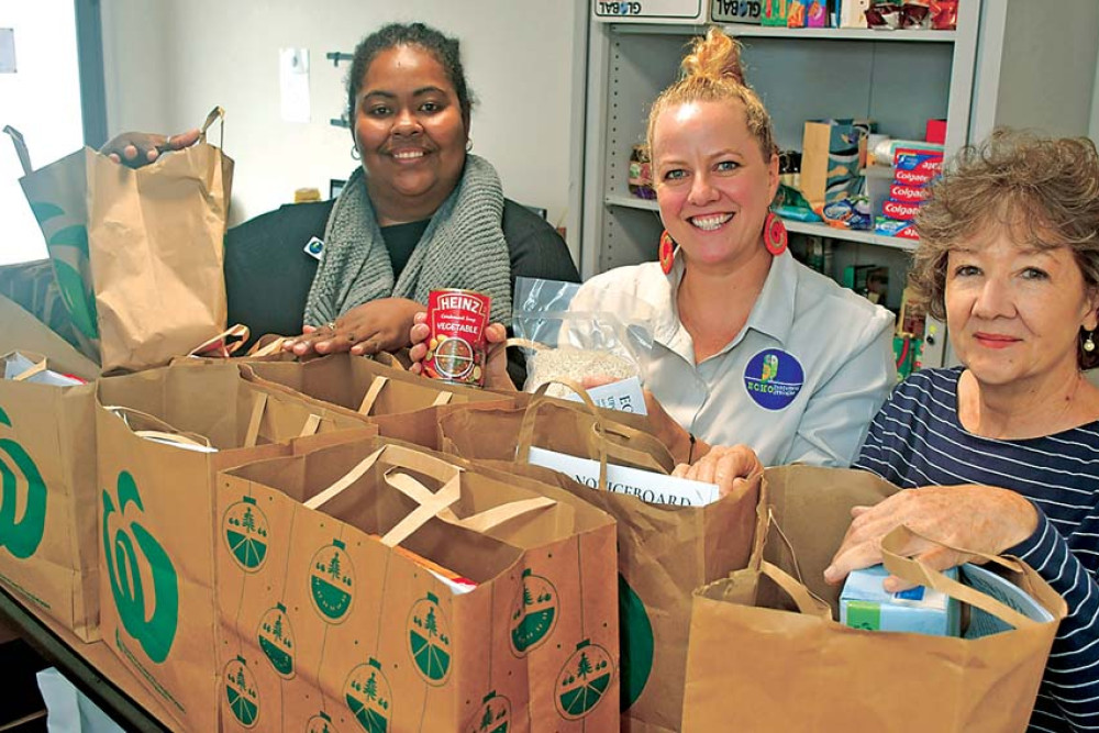 ECHO’s Community development Officer Kylee Clubb (left), Neighbourhood House manager Donna Cifuentes and volunteer Susan Richardson are appealing for food and other items to help families in need.