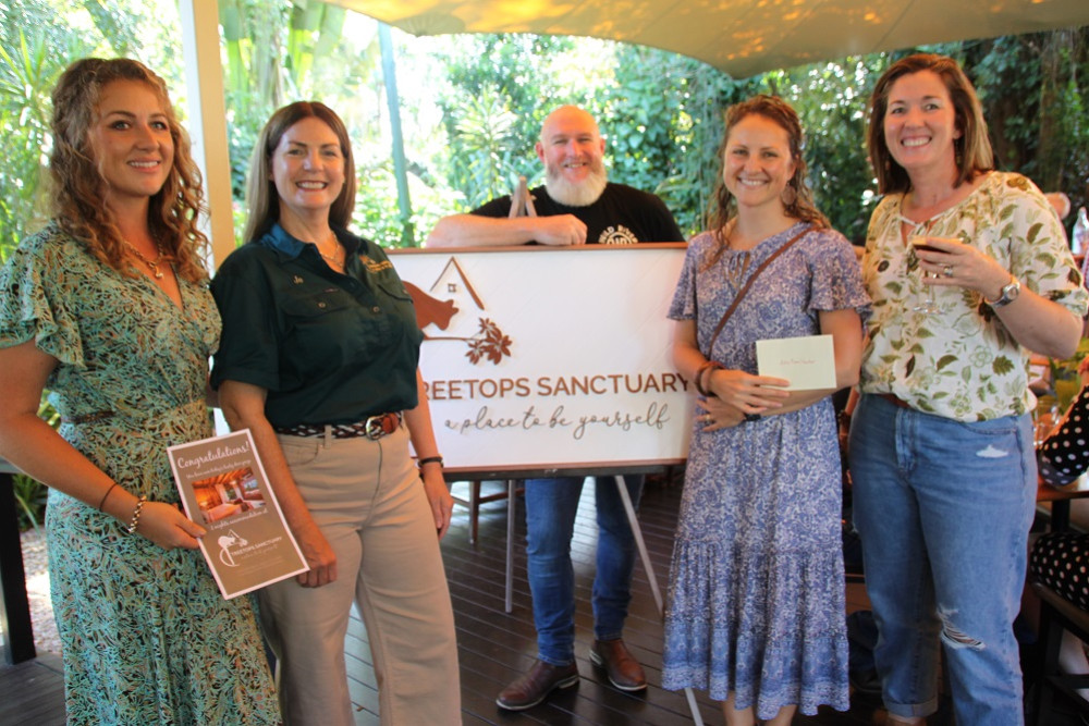 Lucky prize winners on the day were Sasha Bucknell, who won two nights at Treetops Sanctuary, Malanda, from property owner, Jo Murphy and Briana Eaton who won gift packs from Wild River Mountain Distillery owner, Wes Marks (back) and Crater Mountain Coffee owner Lucy Stocker and a dinner for two from Little Eden.