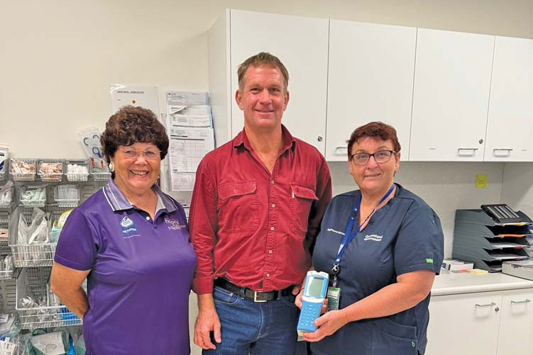 Mareeba Hospital Friends of the Foundation representative Robyn Boundy, Rotary FNQ Field Days former chairman Kevin Davies and Dimbulah Primary Health Centre Director of Nursing Glory Butler with the new iStat machine.