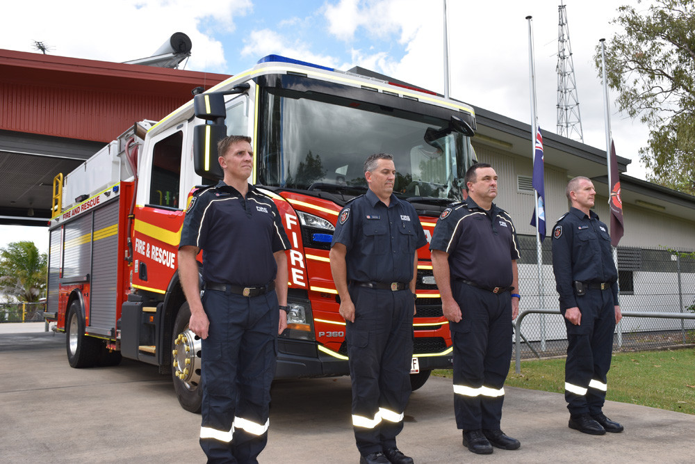 Mareeba Fire Station officers Shane Hetherington, Jason Ryan, Phil Catling and Kevin Richards observing a minute’s silence in honour of Izabella Nash who passed away last week