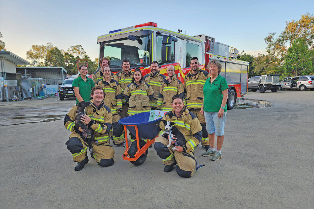 RACE READY: Members of the Queensland Fire and Rescue Service Great Wheelbarrow race team. Front row from left: team captain Jared Hohns and Dylan Atkinson. Back row from left Jordan Hohns, Megan Hendry, Jason Lea, Tracy Marcel, Tommy Daly, Kyle Rayner and Haydan Bonaccorsi with Mareeba Animal Refuge volunteer Felicity Polard and manager Jennifer Walsh.