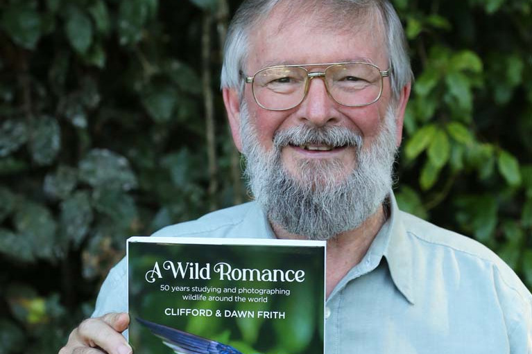 Cliff Frith OAM with the book A Wild Romance which he and his wife Dawn recently released.