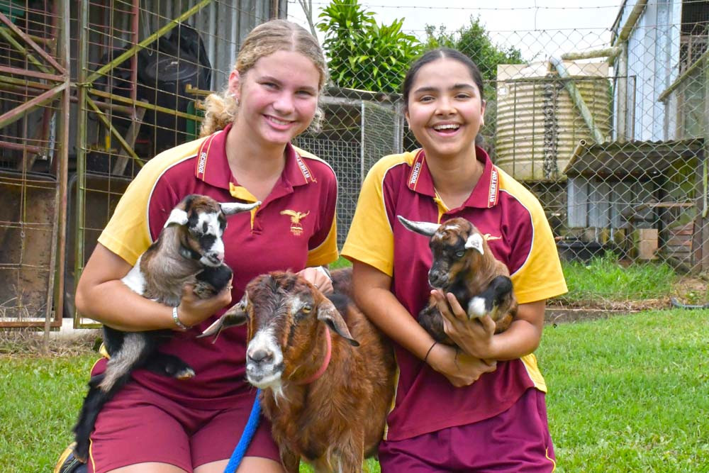 Students Tylah and Sky with the baby goats born three weeks ago and their mum, Opal.