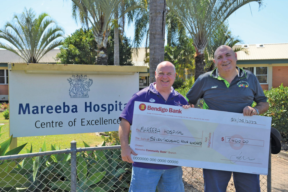 Mareeba Friends of the Hospital Foundation president Neil Setford received the $7,500 donation from FNQ Growers president Joe Moro.