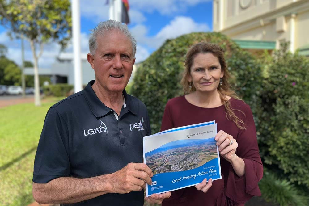 Mayor Rod Marti and Tablelands Community Housing Association manager Cate Teece, with the Local Housing Action Plan.