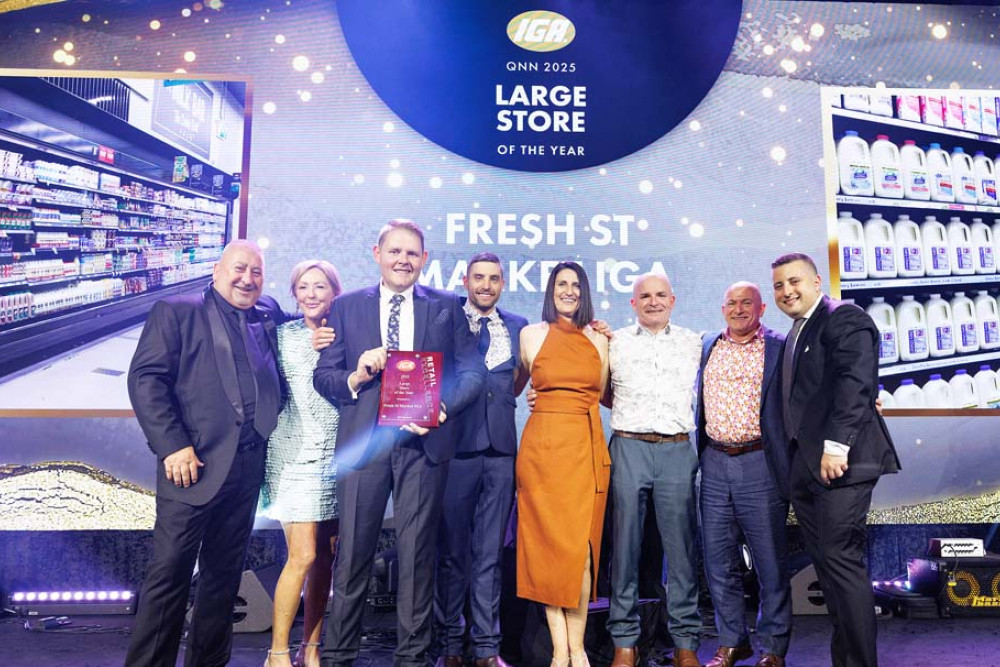 The team from Fresh St Market IGA at Atherton receiving their award. (from left): Roy Leisk, Monique Appi, Matt Bowles, Steven Studham, Sophie Irvine, Christian Pattinson, Andrew Kellett and Frank Spano.