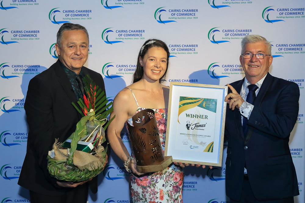 James Home Services director Justin Kelly and CEO Rhiannon Simcocks receiving the 2022 JCU Business Excellence Awards Innovation Excellence award from Cairns deputy mayor Terry James.