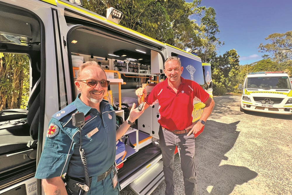 Kuranda ambulance station officer-in-charge Leon Cartledge gets the keys to the new $252,000 Mercedes Sprinter 419 ambulance from member for Barron River Craig Crawford.