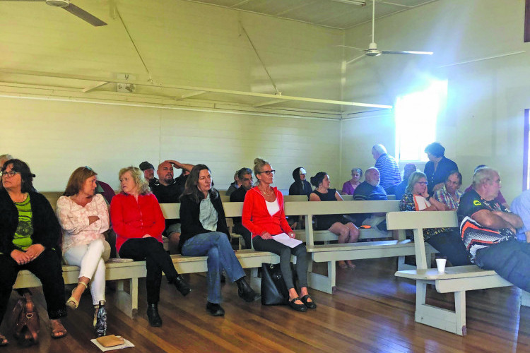 Lakeside Caravan Park resident Jenny Sadar, pictured in red and seated in the middle waits to provide her deputation during TRC’s July meeting in Ravenshoe.