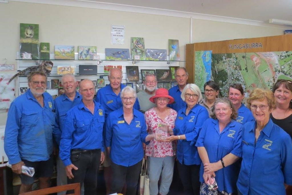 The Yungaburra Landcare Group with the AIH trophy and Yungaburra Visitor Information Centre volunteers. The trophy will be kept at the VIC.