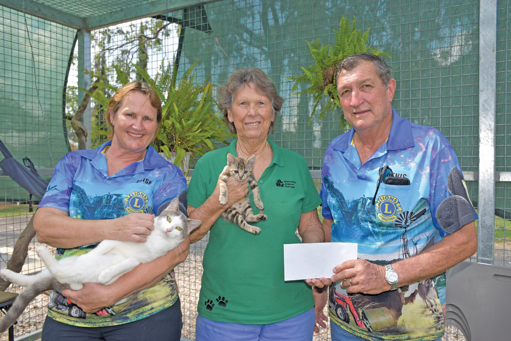 Mareeba Lions Club members Deanna Percy and Denis McKinley handing over the $350 donation to Mareeba Animal Refuge manager Jennifer Walsh.