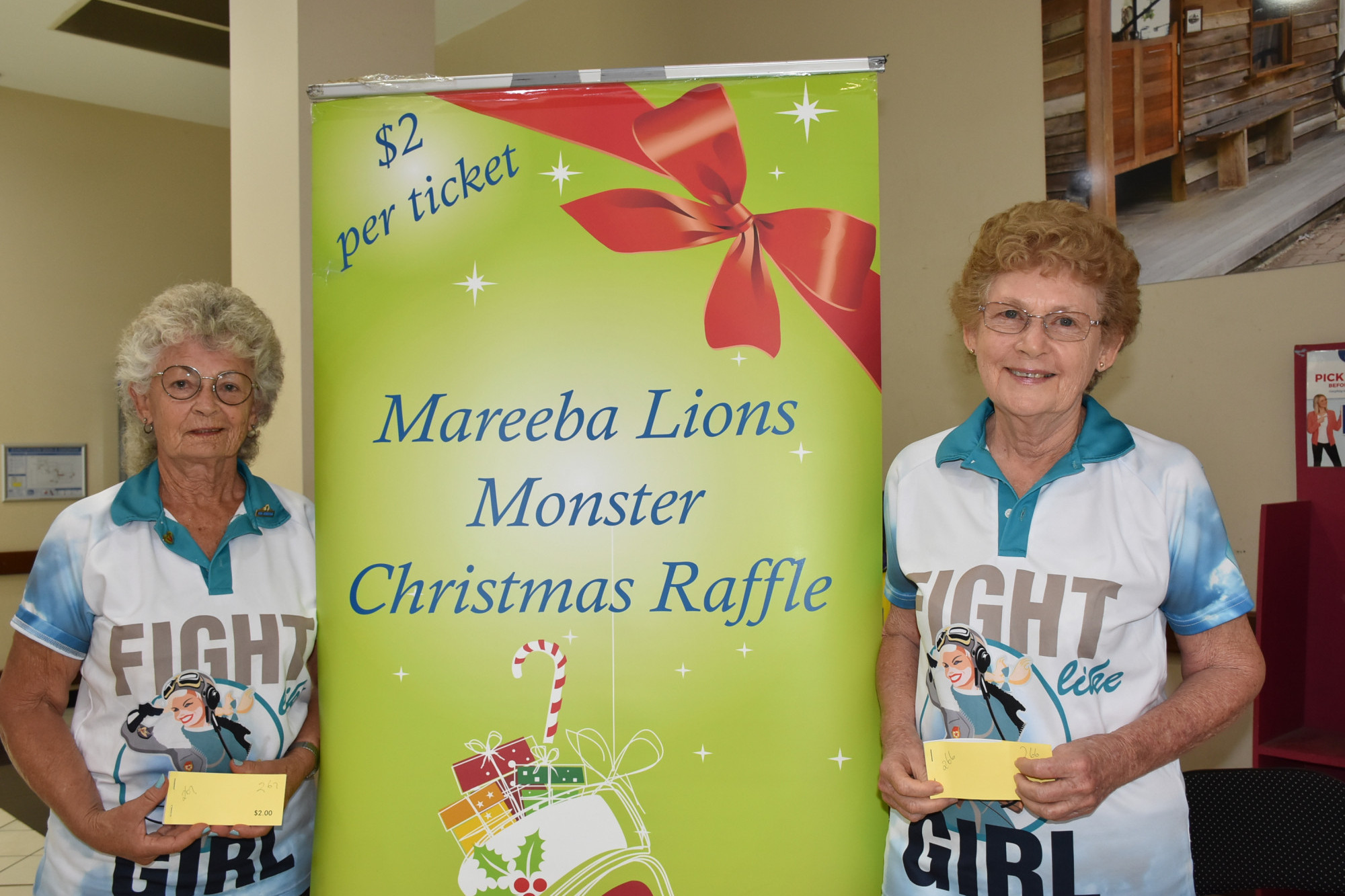 Mareeba Lions volunteers Rena Braes and Eve-Lyn McGrath have been selling tickets for the Mareeba Lions Christmas Raffle since it started in October
