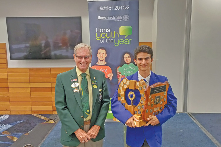 District winner of Lions Youth of the Year Yaseen Al Kahlout from Malanda State High School with the District Governor Michael MacLaren