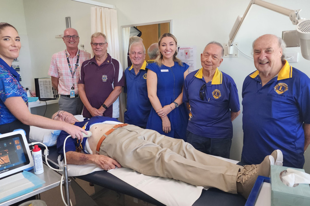 Cairns Lions Club members with Cairns Hospital staff testing out the new portable fibroscan machine