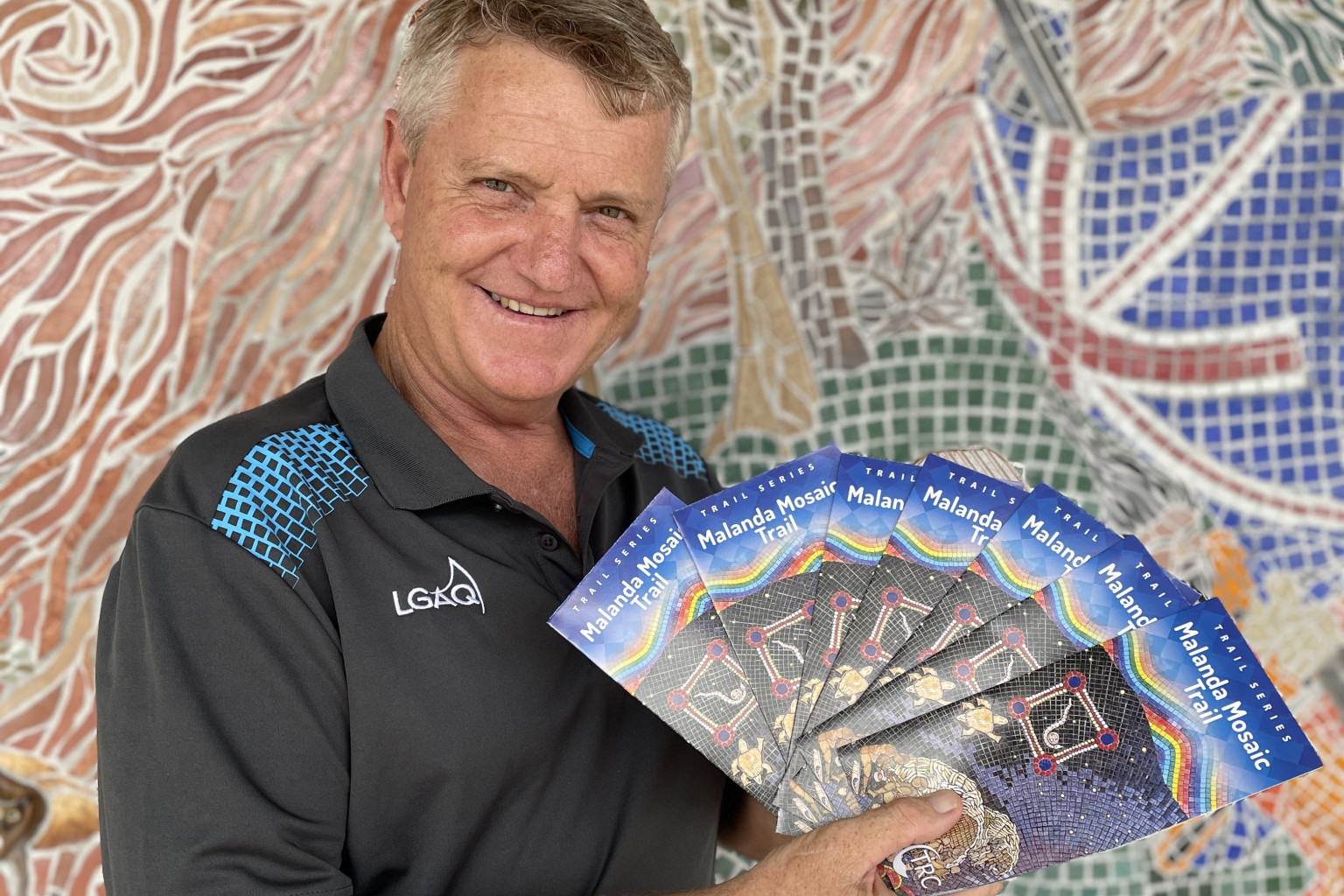 TRC Deputy Mayor Dave Bilney with the new mosaic trail brochure.