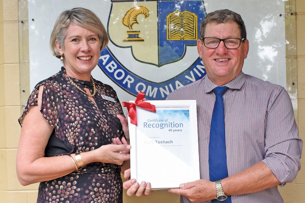 Malanda State High School principal Gary Toshach was recognised for his 40 years with Education Queensland with Assistant Regional Director Education Queensland Mandy Whybird.