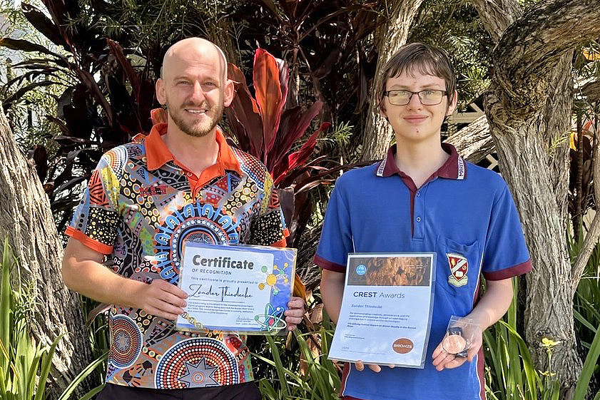 Mareeba High&rsquo;s head of junior secondary Dan Leschke (left) helps Zander Thiedecke show off his awards.