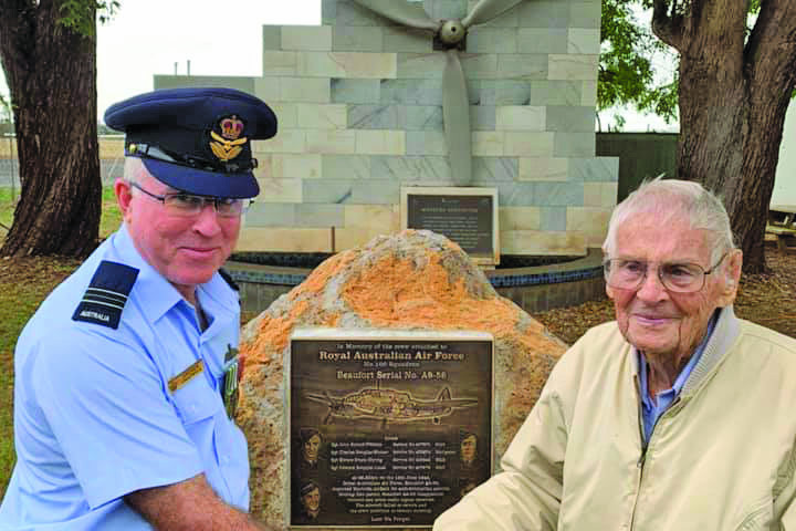 Royal Australian Air Force Squadron Leader Andrew Chadwick and Jock Hucker, brother of one of the missing crewman unveiling the plaque.