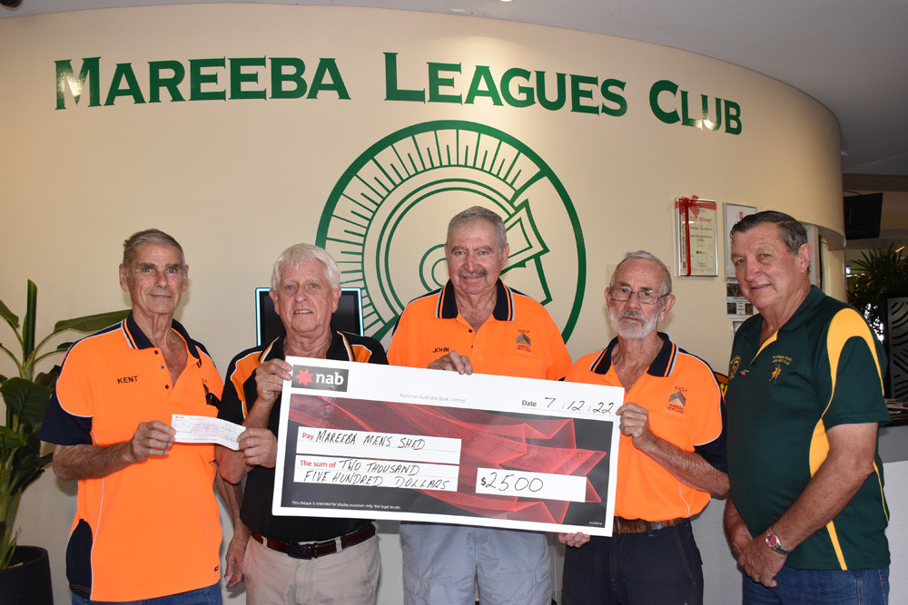 Mareeba Leagues Club president David Christinsen and secretary Dennis McKinley presenting Mareeba Mens Shed members Kent Duffield, John Torrisi and Cec Ayliffe with a cheque for $2500 to purchase a defibrillator.