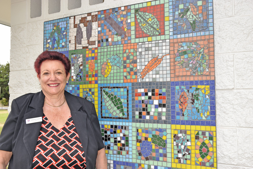 Mareeba Mayor Angela Toppin beside the new mosaic installed at Centenary Park.