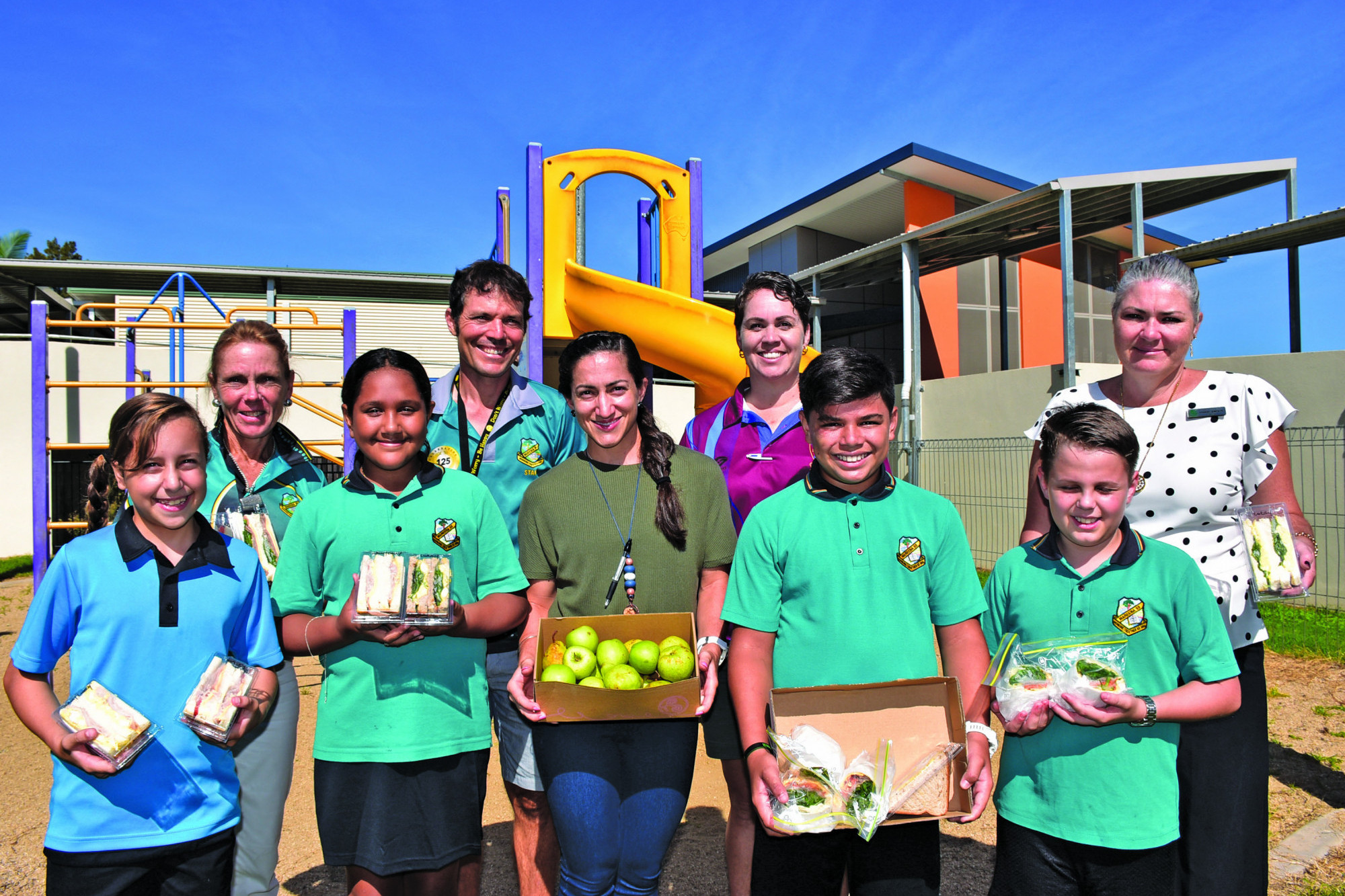 COMMUNITY: Teachers and students at Mareeba State Primary School with the emergency lunches that are being provided by The Hungry Pug in Mareeba.