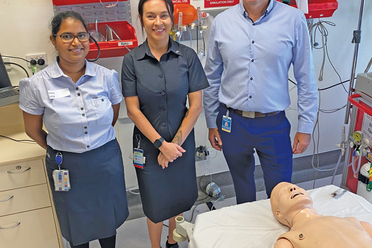 Nursing graduates Indira Lena and Ebonie Campbell with Executive Director of Nursing and Midwifery Cameron Duffy.