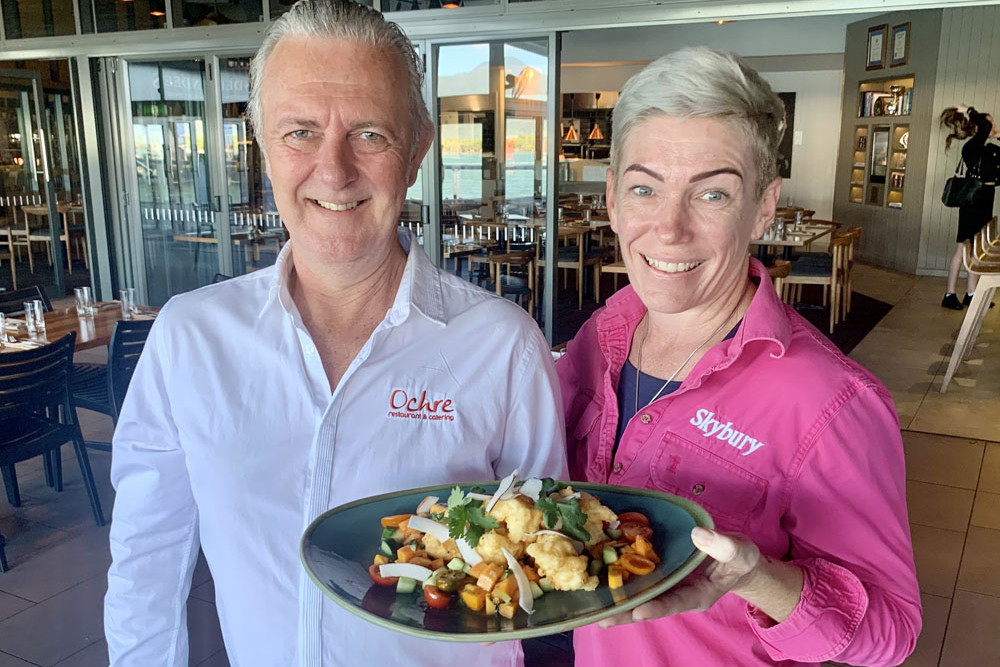 Candy MacLaughlin and Cairns restauranteur Craig Squire from Ochre Restaurant sample a dish for Papaya Week.