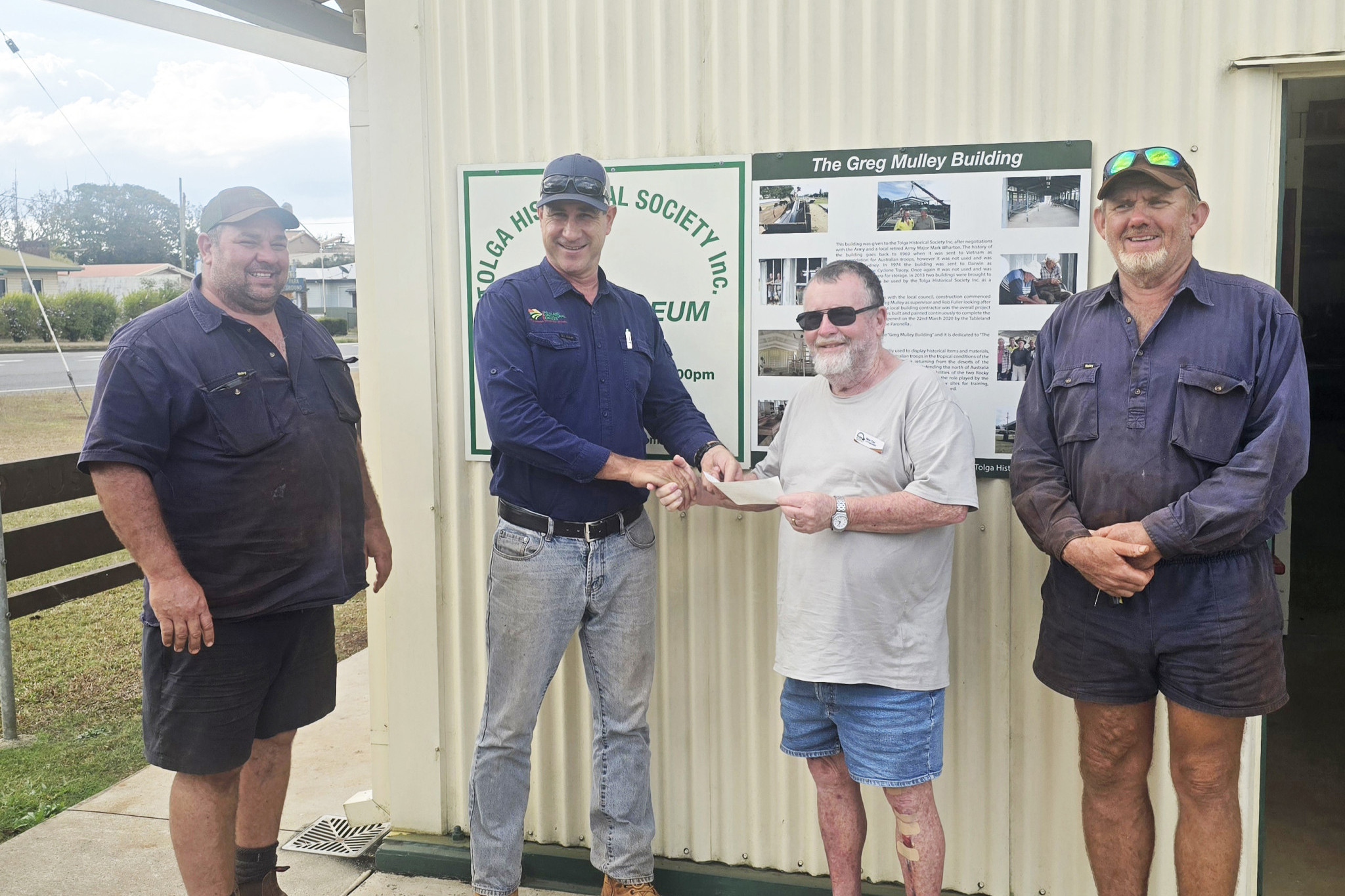 Tolga Historical Society president Richard Standen and treasurer Mick Carr receiving the cheque from Peanut Growers secretary Zane Micola and chairman Roger Pezzalato.