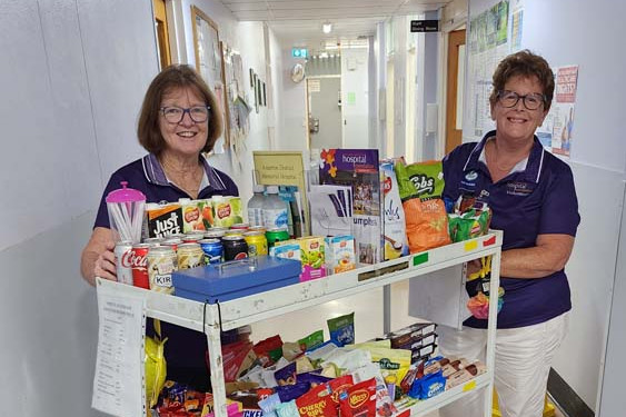 Atherton Hospital Friends of the Foundation volunteers Jo Barnes and Mary Fitzsimons with the trolley that services patients.